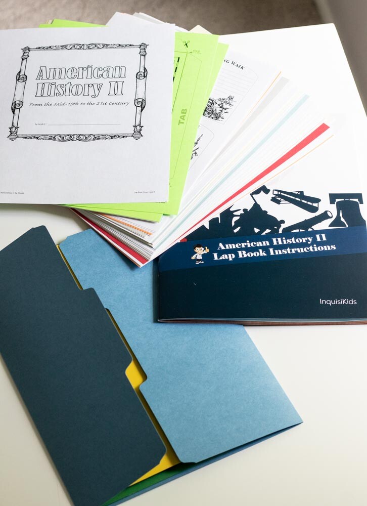 Lap book folder, instructions, and preprinted pages shown on table