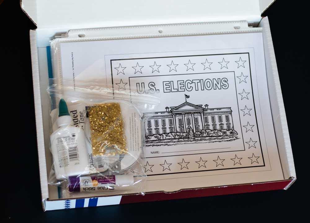 After separating Elections Lap Book activities with sheet protectors, you can store them in the box with the remaining supplies.