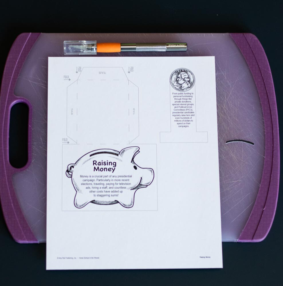 Use a craft knife to cut the coin slot on the piggy bank in the Raising Money activity.