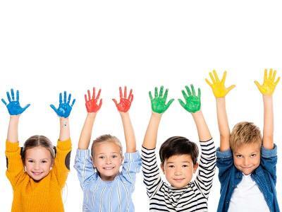 four children holding up their hands painted in blue, red, green, and yellow to match the four temperaments