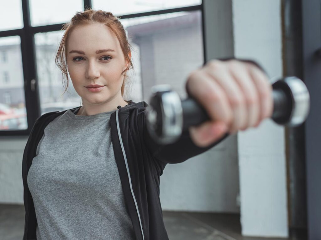 woman holding hand weight